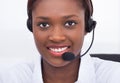 Confident receptionist using headset in hospital Royalty Free Stock Photo