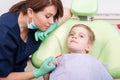 Confident and relaxed child sitting in dentist chair Royalty Free Stock Photo