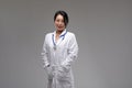 Confident relaxed female Asian doctor or nurse Royalty Free Stock Photo