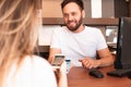 Salesman receiving payment with qr code and mobile at counter store Royalty Free Stock Photo