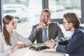 confident serious business people using conference phone