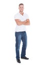 Confident attractive young man in jeans and a t-shirt