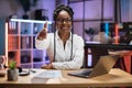 Confident skilled african female trader or office worker sitting in front of laptop in online meeting