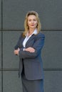 Confident smart businesswoman with folded arms Royalty Free Stock Photo