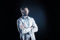 Confident smart scientist standing cross handed