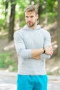 Confident sportsman. Runner workout outdoor in park. Man athlete with smart watch running outdoor, nature background