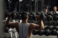 Confident strong weightlifter having a workout