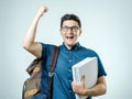 Studio portrait of handsome young man with backpack Royalty Free Stock Photo