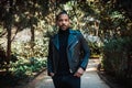 Confident stylish african american man wearing black leather jacket outdoor. Street wear fashion black man Royalty Free Stock Photo