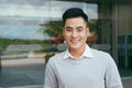 Confident and successful antrepreneur, office man or corporate guy, standing with elegant outfit in front of an office building - Royalty Free Stock Photo