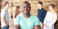 Confident successful black business man in front of group of people. Royalty Free Stock Photo