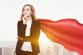 Superwoman businesswoman finance superhero, city