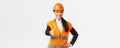 Confident successful female architect, leader of construction in safety helmet, reflective jacket, extand hand for Royalty Free Stock Photo