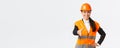 Confident successful female architect, leader of construction in safety helmet, reflective jacket, extand hand for