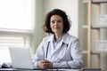 Confident successful mature female doctor, general practitioner Royalty Free Stock Photo