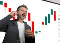 Confident successful trader man with headset speaking at event coaching trading business at auditorium or conference room teaching Royalty Free Stock Photo