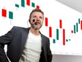 Confident successful trader man with headset speaking at event coaching trading business at auditorium or conference room teaching