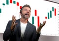 Confident successful trader man with headset speaking at event coaching trading business at auditorium or conference room teaching Royalty Free Stock Photo