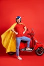 Confident super hero biker man going at party, serious guy in helmet Royalty Free Stock Photo