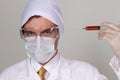 Confident surgeon holding a syringe