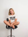 Confident teen girl in t-shirt break the rules. Teenager protest concept