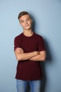 Confident teenage boy on color background Royalty Free Stock Photo