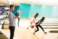 Confident Teenage Boy With Friends Bowling In Club Royalty Free Stock Photo