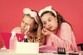Confident in their choice. small girls in beauty salon. little sisters in retro fashion headscarf. makeup for kids Royalty Free Stock Photo