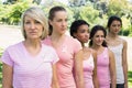 Confident volunteers supporting breast cancer awareness Royalty Free Stock Photo