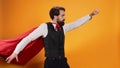 Confident waiter with red hero cape