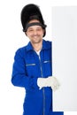 Confident welder presenting empty board Royalty Free Stock Photo