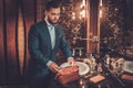 Confident well-dressed man in Luxury bathroom interior.