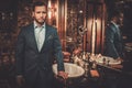 Confident well-dressed man in Luxury bathroom interior.