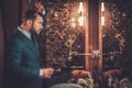 Confident well-dressed man in Luxury bathroom interior. Royalty Free Stock Photo