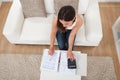 Confident woman calculating home finances at table Royalty Free Stock Photo