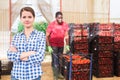 Confident woman greenhouse owner in vegetable store