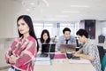 Confident woman with her business team in office Royalty Free Stock Photo