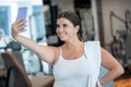 Confident woman making a selfie in a gym Royalty Free Stock Photo