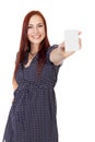 Confident Woman With Red Hair holds a blank business card vertically. Royalty Free Stock Photo