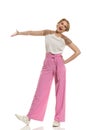 Confident Woman In Striped Wide Legs Trousers Is Gesture And Talking