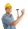 Confident worker hammering in Royalty Free Stock Photo