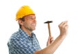 Confident worker hammering in Royalty Free Stock Photo