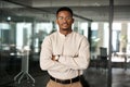 Confident young African American business man standing in office, portrait. Royalty Free Stock Photo