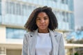 Confident young African American business woman standing on street, portrait. Royalty Free Stock Photo