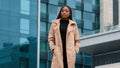 Confident young african american businesswoman standing in front of office building waiting for meeting attractive Royalty Free Stock Photo