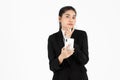 Confident young Asian business woman in suit with mobile smart phone having good idea posing over white isolated background Royalty Free Stock Photo