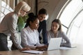 Confident young Asian professional presenting project to coworkers