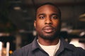 Confident Young Black Male Standing In Office Looking At Camera Royalty Free Stock Photo