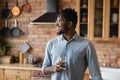 Confident young black man drink aqua proud of successful life