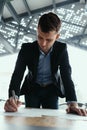 Successful business man signing documents in a modern office Royalty Free Stock Photo